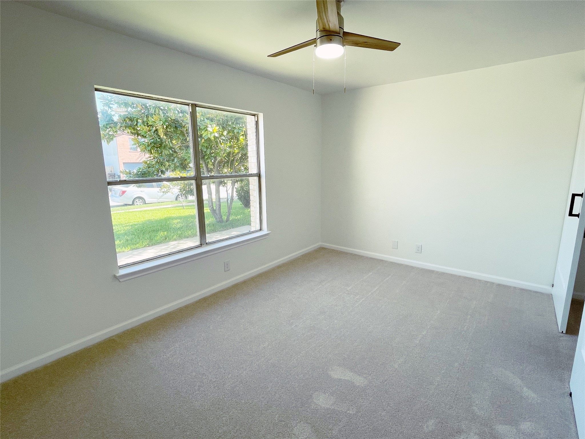 1103 Pike Path Round Rock, TX 78665 - Photo 25 of 36 This window not only enhances the room's brightness but also offers a refreshing view of the outdoors, creating a connection to nature from within.