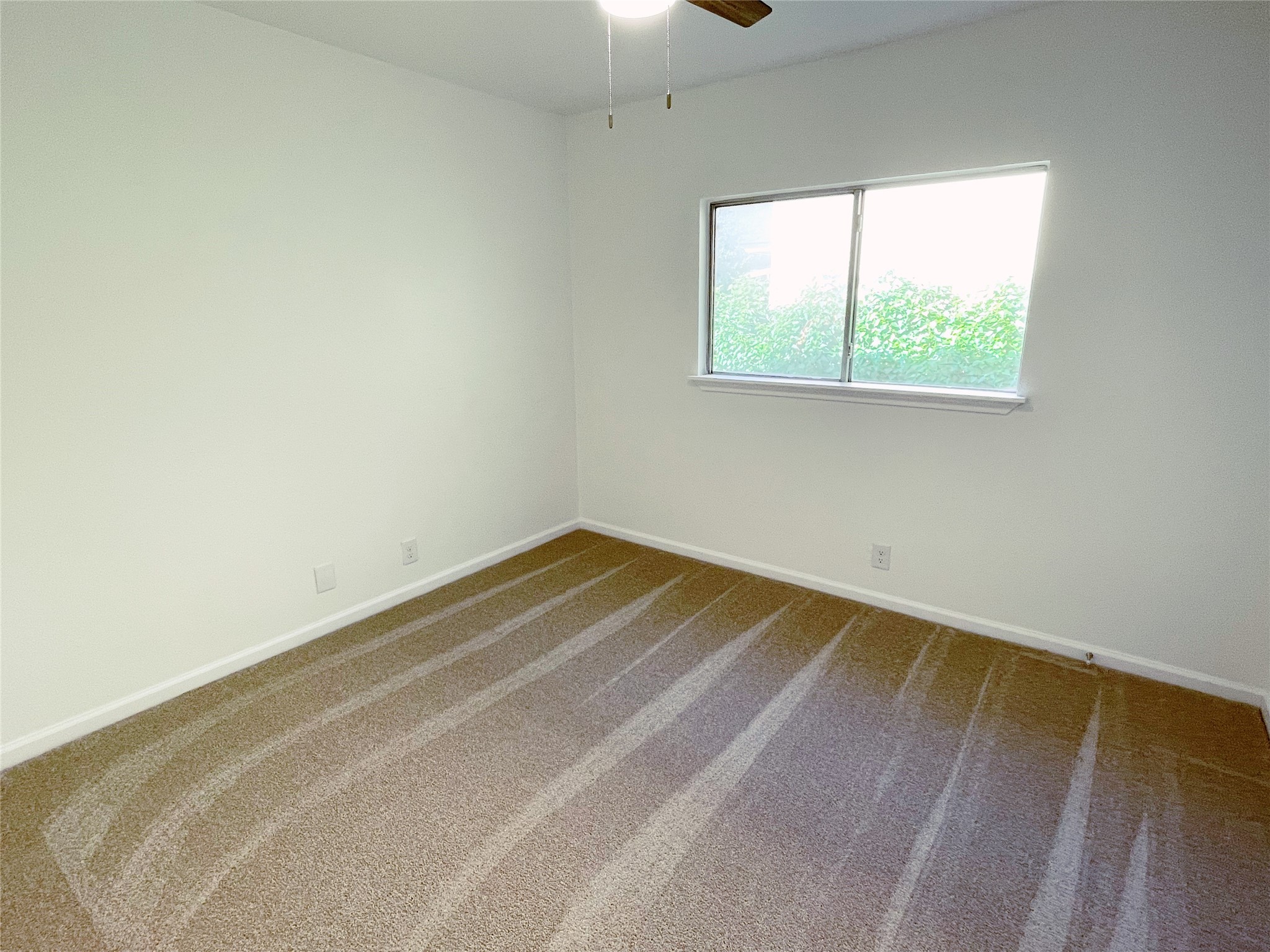 1103 Pike Path Round Rock, TX 78665 - Photo 29 of 36 Whether used as a guest room, home office, or personal retreat, the third bedroom offers a tranquil haven for restful nights and rejuvenating mornings.
