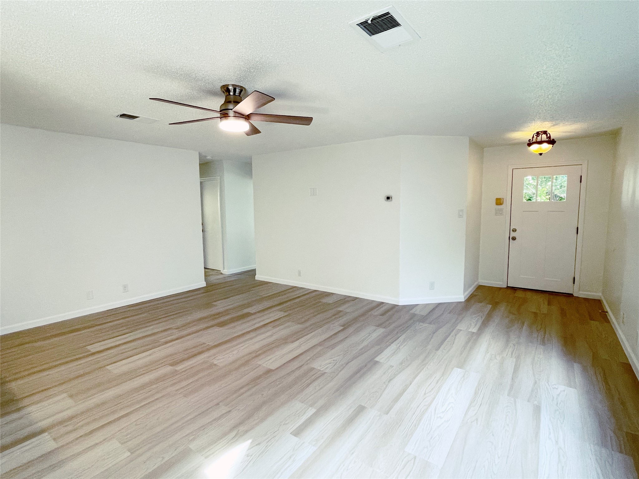 1103 Pike Path Round Rock, TX 78665 - Photo 7 of 36 This room exudes warmth and comfort, creating a cozy atmosphere perfect for unwinding and enjoying moments with loved ones.