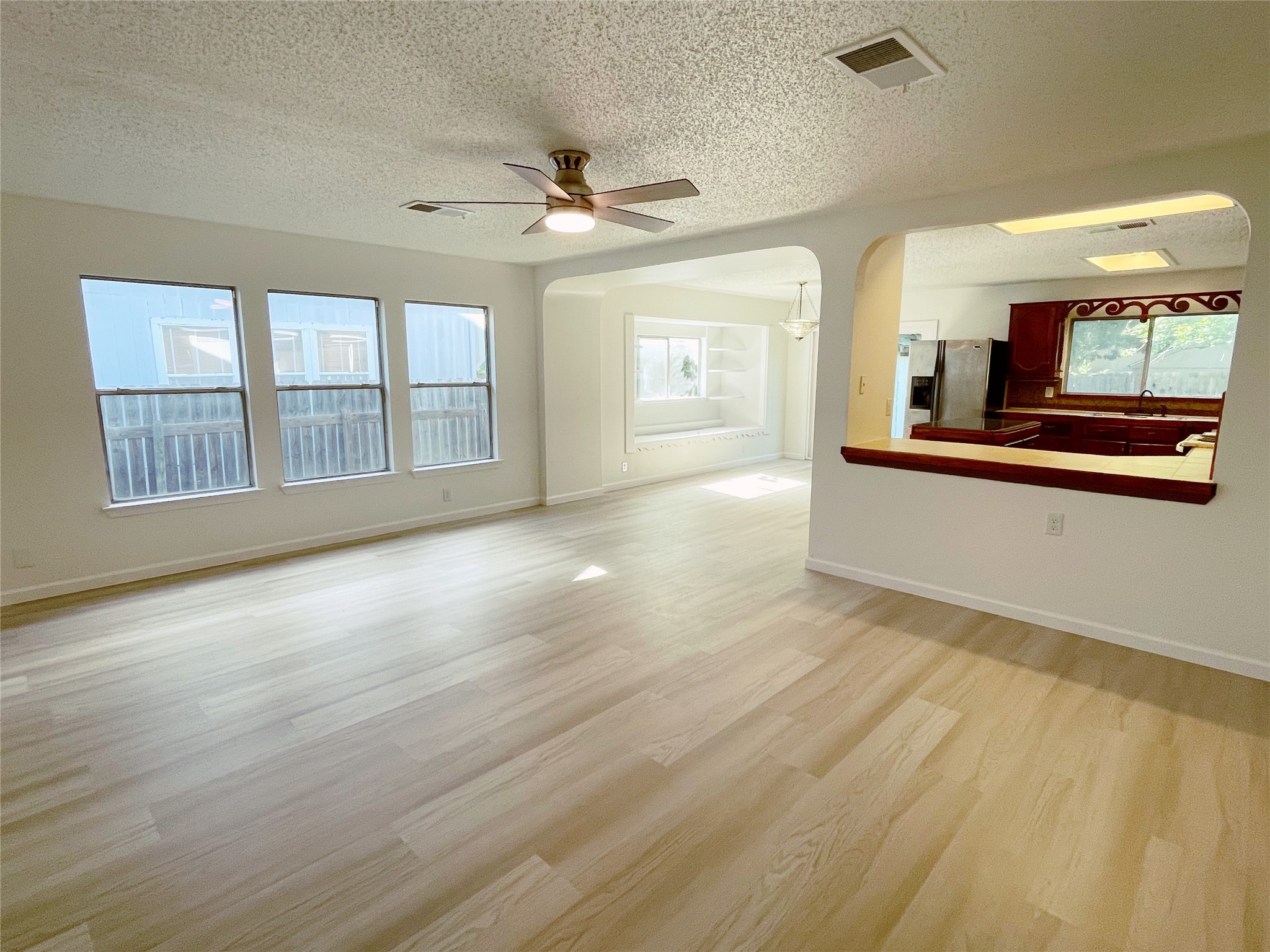 1103 Pike Path Round Rock, TX 78665 - Photo 9 of 36 Seamlessly connected to the kitchen, creating a spacious and cohesive living space.