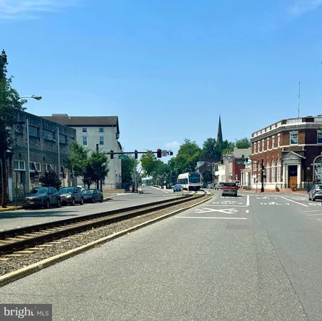 a view of a street with a building in the background