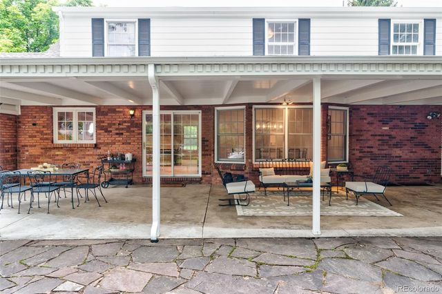 a view of a building with sitting area
