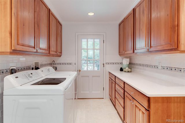 a kitchen with a sink a stove and cabinets