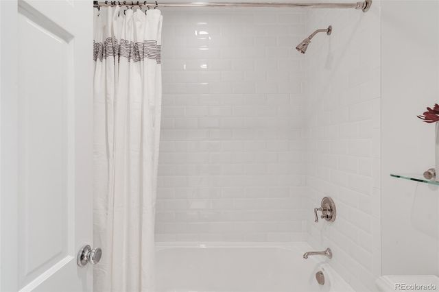 a close up of a bathtub curtain