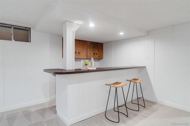 a kitchen with a sink cabinets and white stainless steel appliances