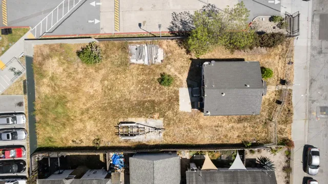 a view of a lake with houses in the background