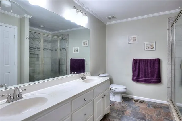 a bedroom with a bed and a television