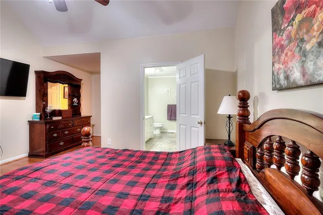 a living room with furniture ceiling fan and a rug