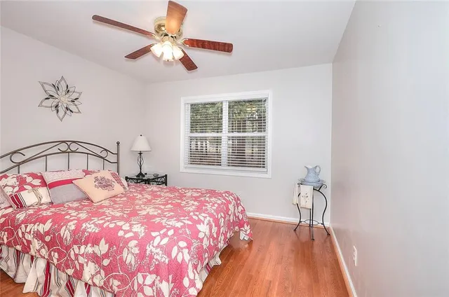 a bathroom with a sink a toilet and shower curtain