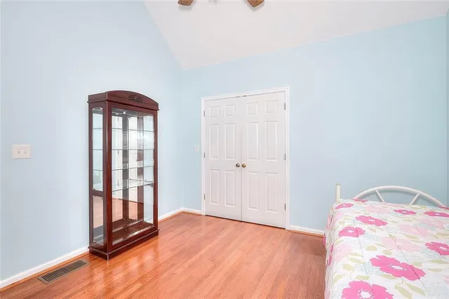 a view of a patio with a table chairs and wooden floor