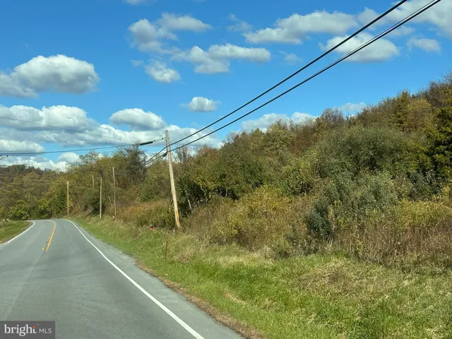 a view of an ocean and a mountain