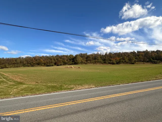 a view of an swimming pool and an outdoor seating