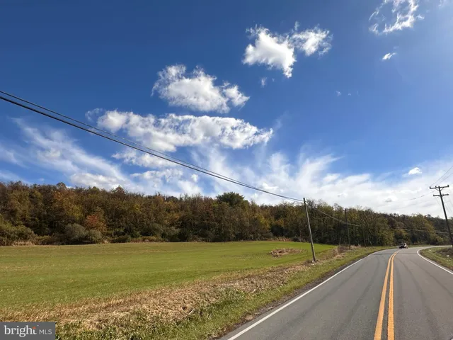 a view of a golf course with a swimming pool