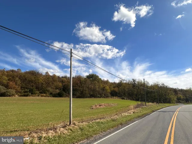a view of a fountain in middle of the river