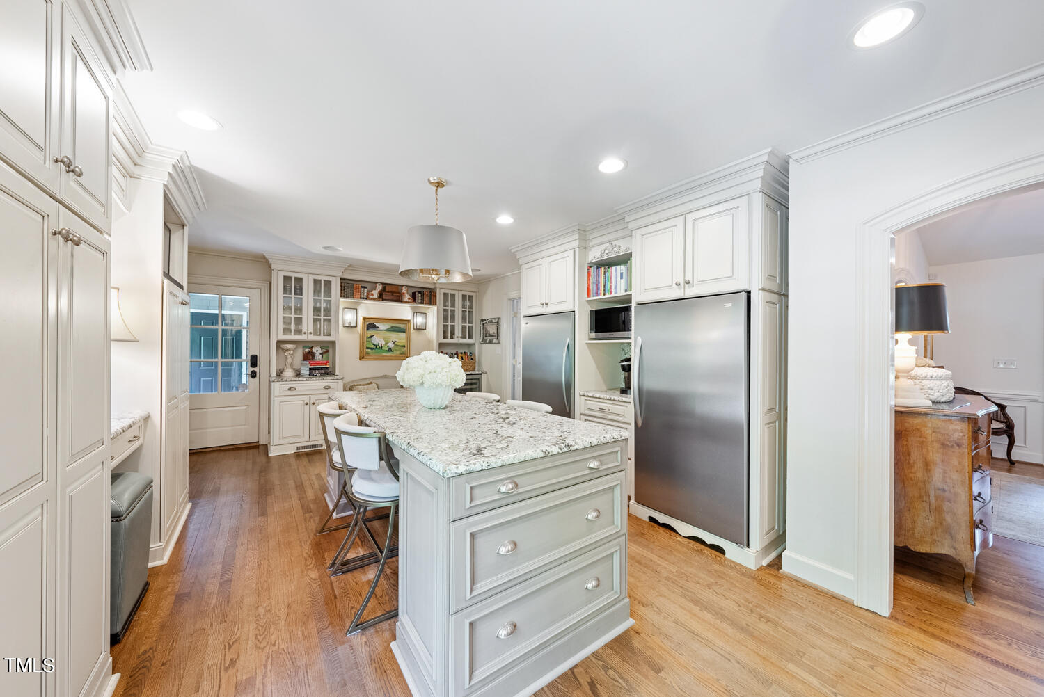 2421 Tyson Street Raleigh, NC 27612 - Photo 17 of 61 a kitchen with a refrigerator a sink and wooden floor