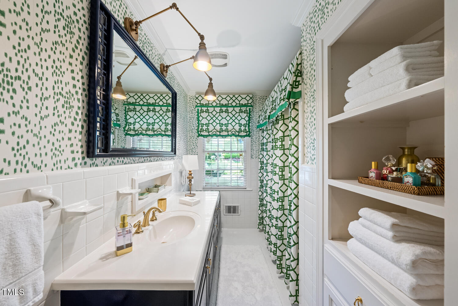 2421 Tyson Street Raleigh, NC 27612 - Photo 26 of 61 a bathroom with a sink a bathtub and a window