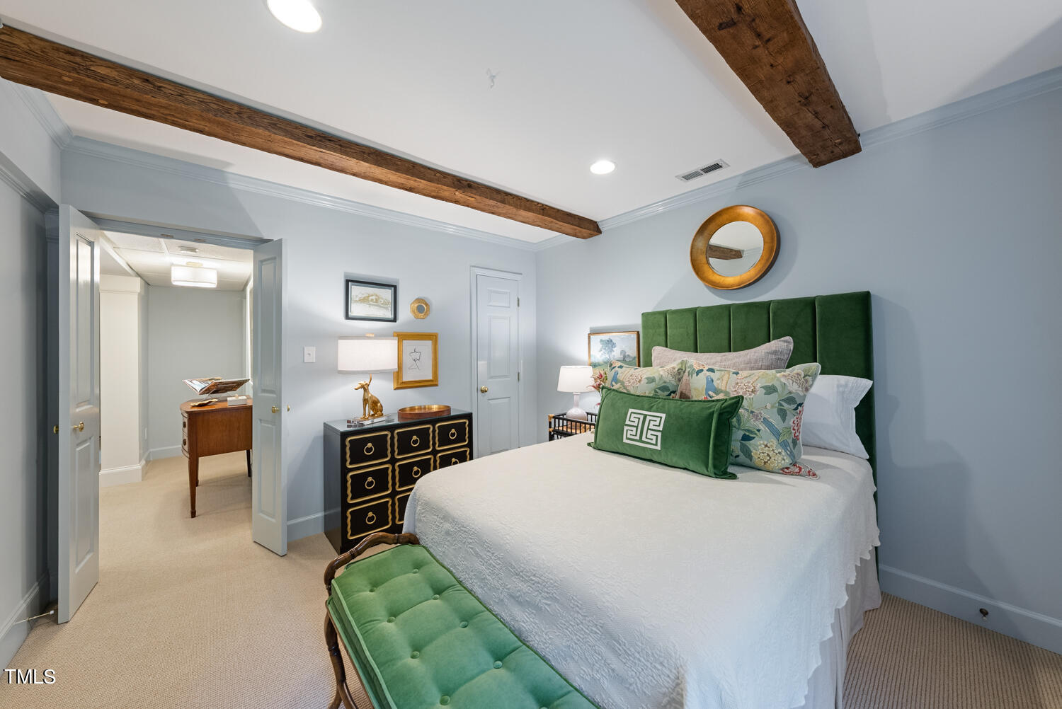 2421 Tyson Street Raleigh, NC 27612 - Photo 36 of 61 a bedroom with a bed and wooden floor