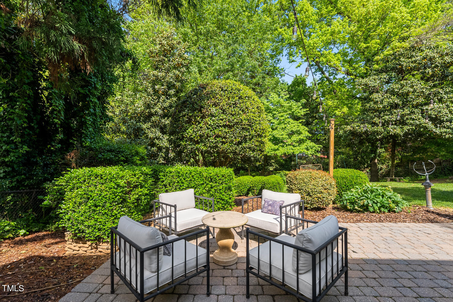 2421 Tyson Street Raleigh, NC 27612 - Photo 41 of 61 a view of a patio with couches table and chairs and garden