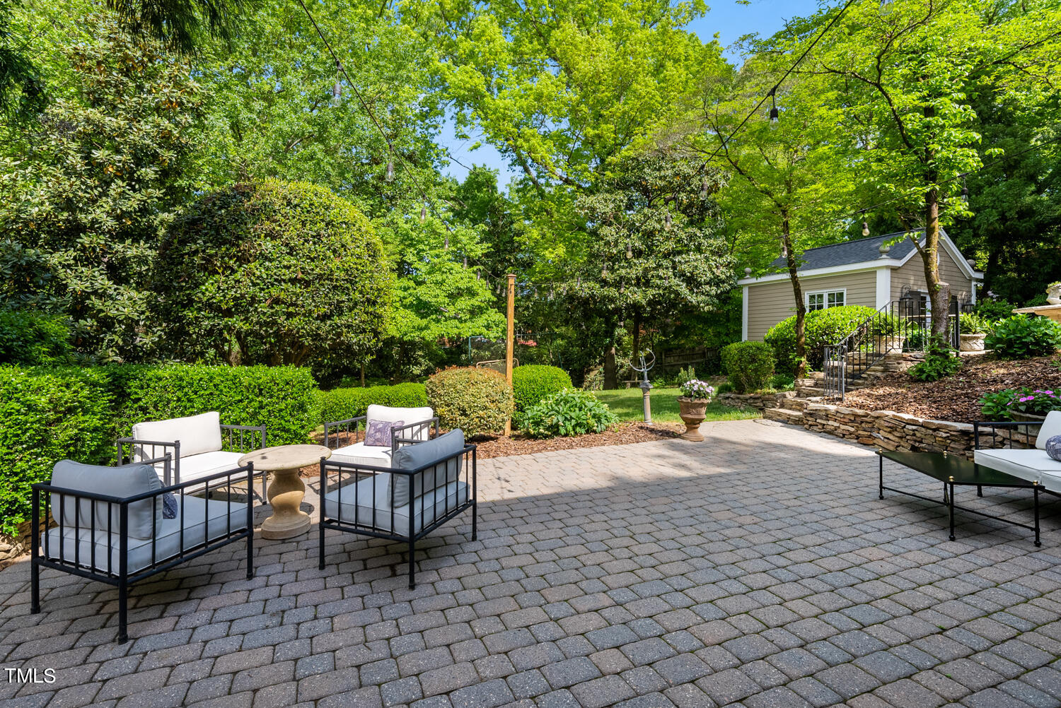 2421 Tyson Street Raleigh, NC 27612 - Photo 42 of 61 a view of a patio with a chairs and table in a patio