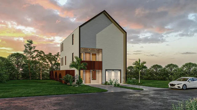 a car parked in front of a house next to a yard