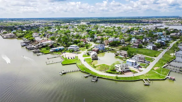 an aerial view of a house with outdoor space swimming pool and ocean view