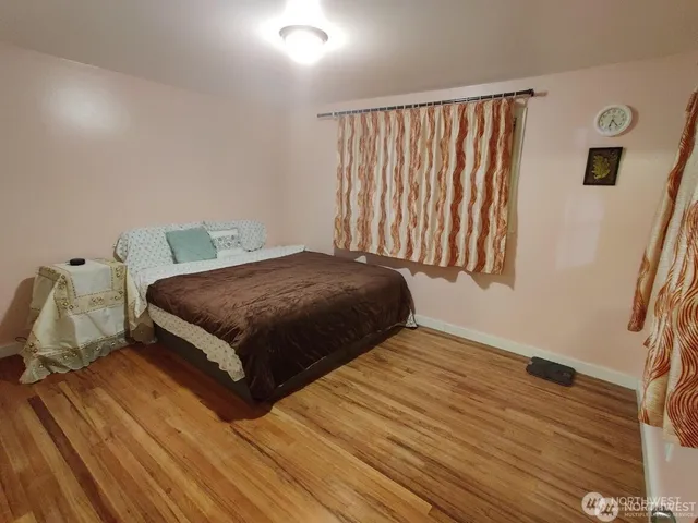 a bedroom with a bed and window