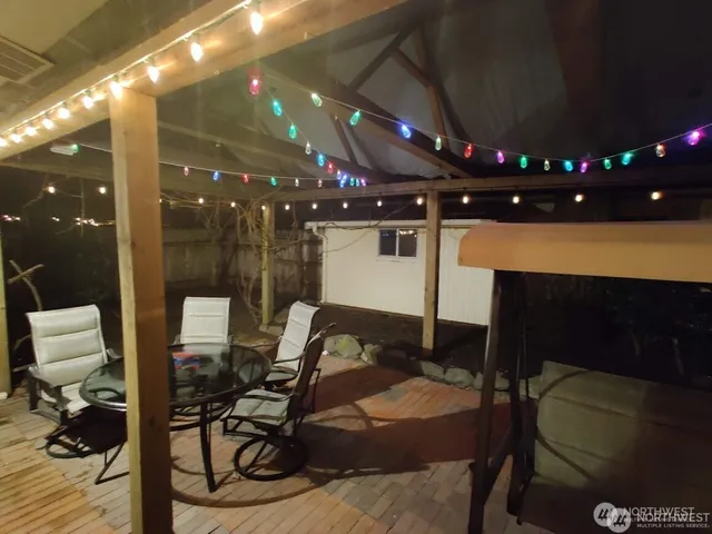 a room with furniture and a ceiling fan