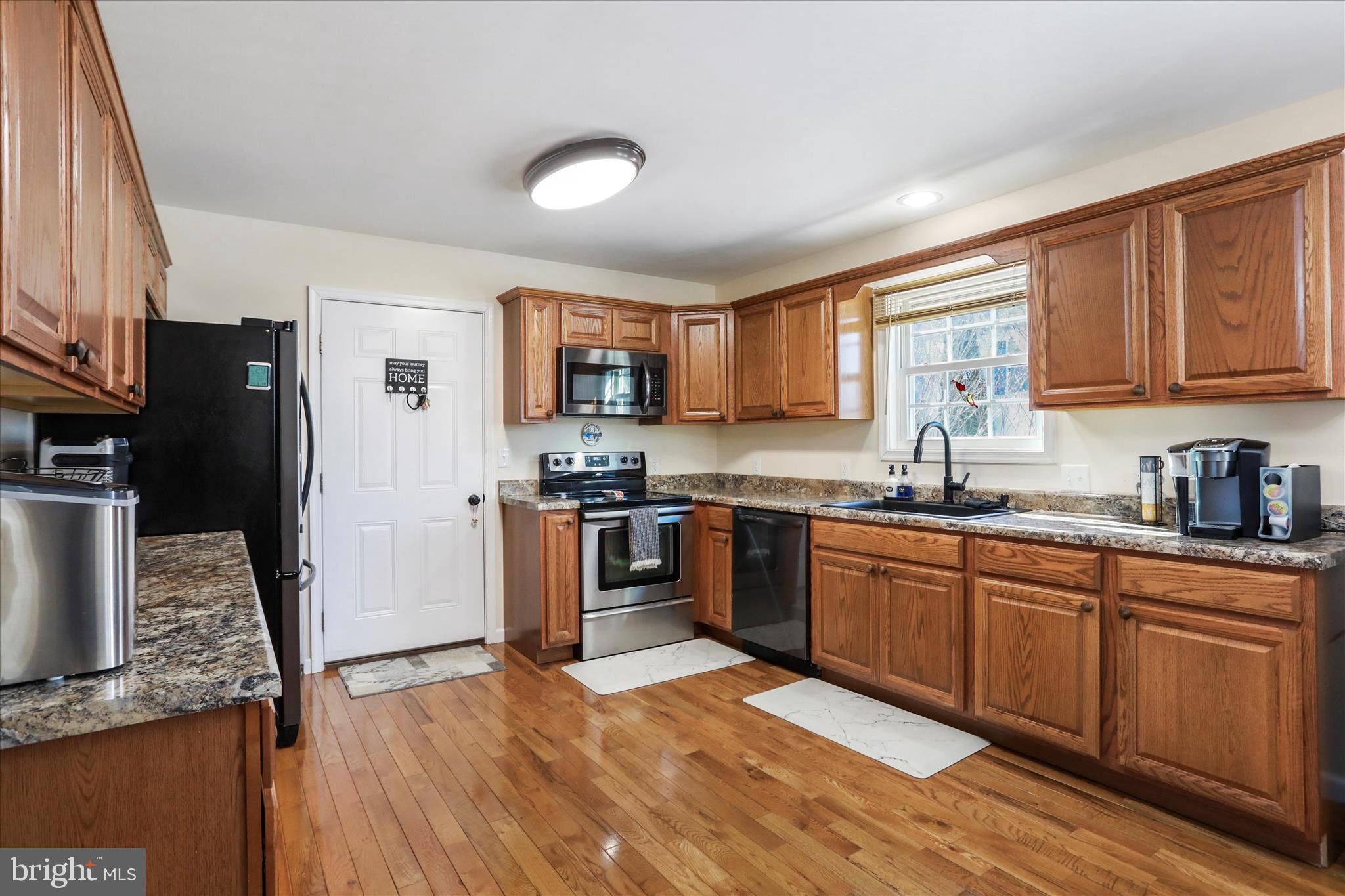 300 Park Road Stanley, VA 22851 - Photo 11 of 33 Door in kitchen leads to double garage