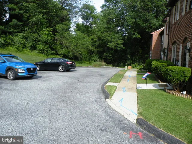 a view of a car parked in front of a house