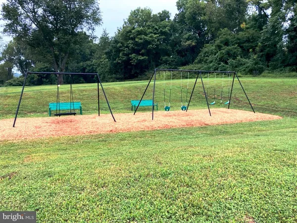a view of a park with a slide