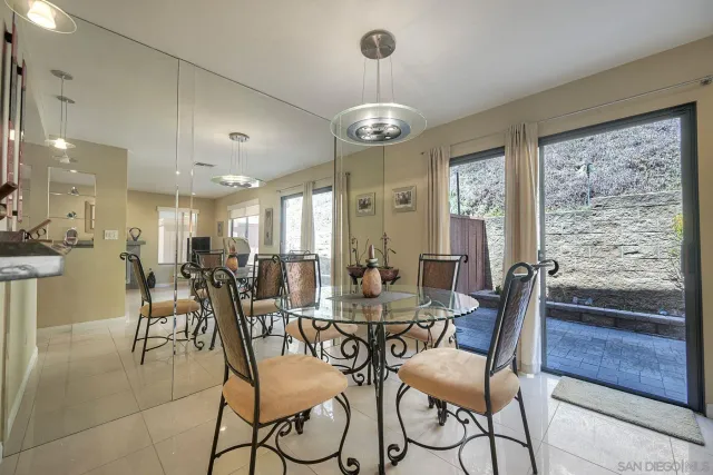 a kitchen with stainless steel appliances granite countertop a sink a stove and a wooden cabinets