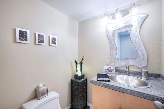 a bathroom with a shower a toilet and a sink