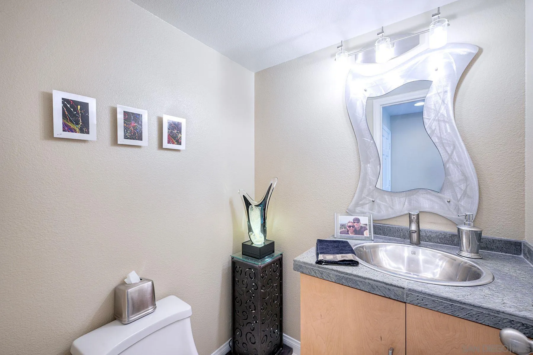3467 Reynard Way, Unit A San Diego, CA 92103 - Photo 15 of 29 a bathroom with a sink and a mirror