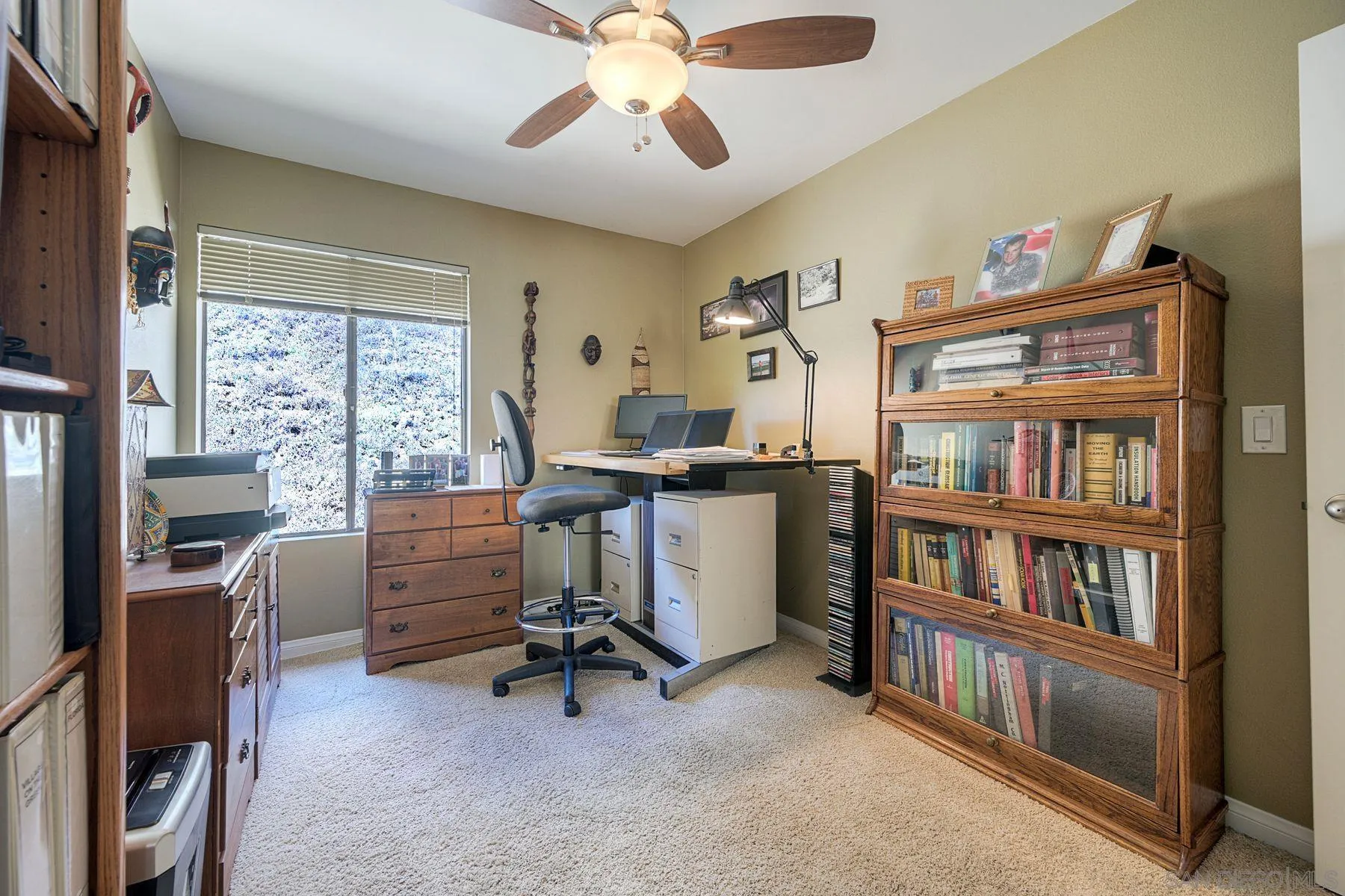 3467 Reynard Way, Unit A San Diego, CA 92103 - Photo 19 of 29 a view of a workspace with furniture and a bookshelf