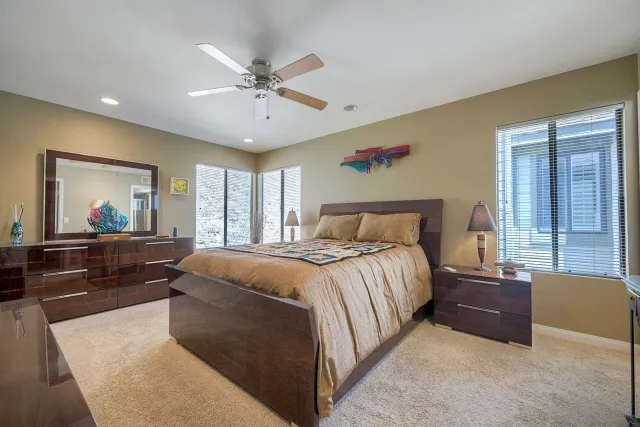 a bedroom with a bed and a couch