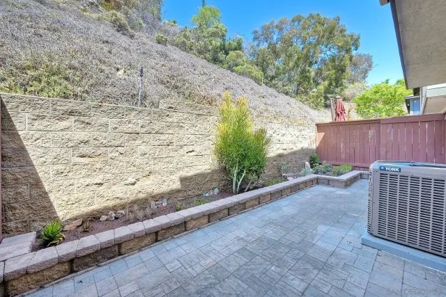 a backyard of a house with outdoor seating