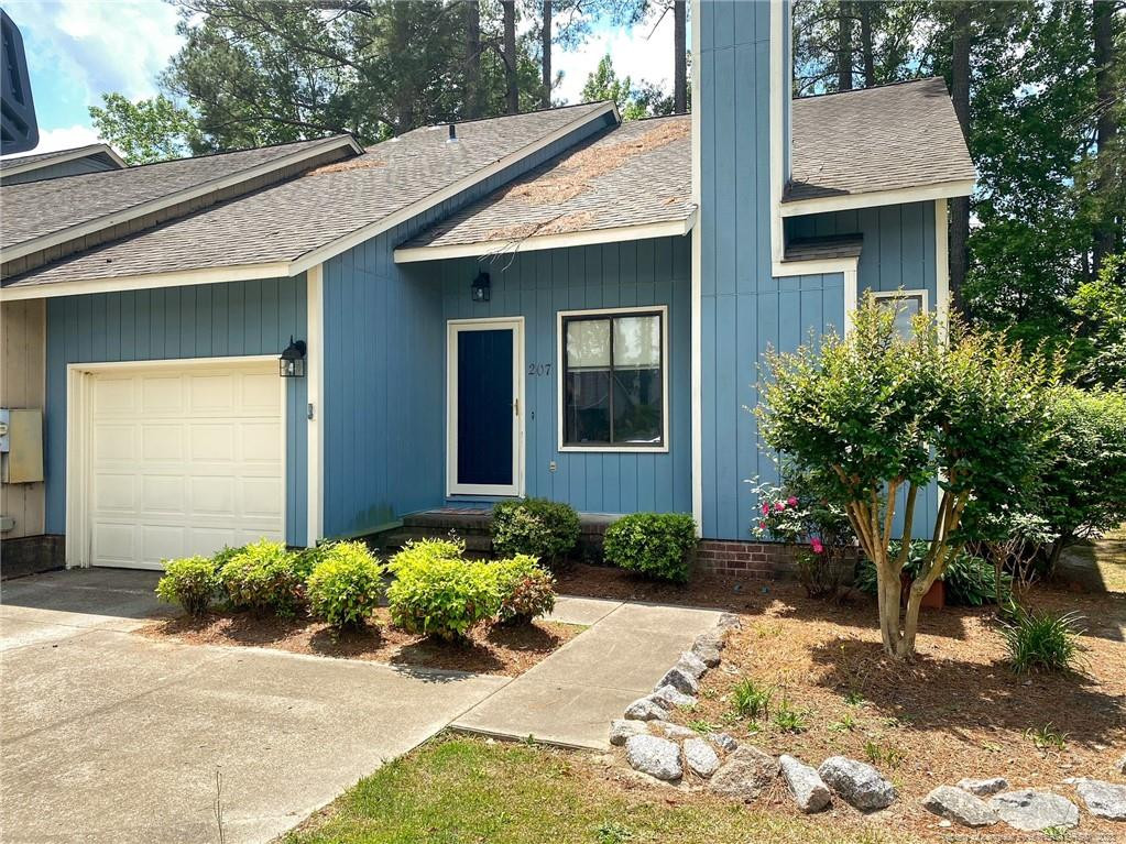 207 Charmant Road Lumberton, NC 28358 - Photo 1 of 24 a front view of a house with a yard