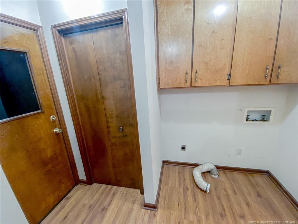 207 Charmant Road Lumberton, NC 28358 - Photo 11 of 24 a view of a storage and utility room with wooden floor