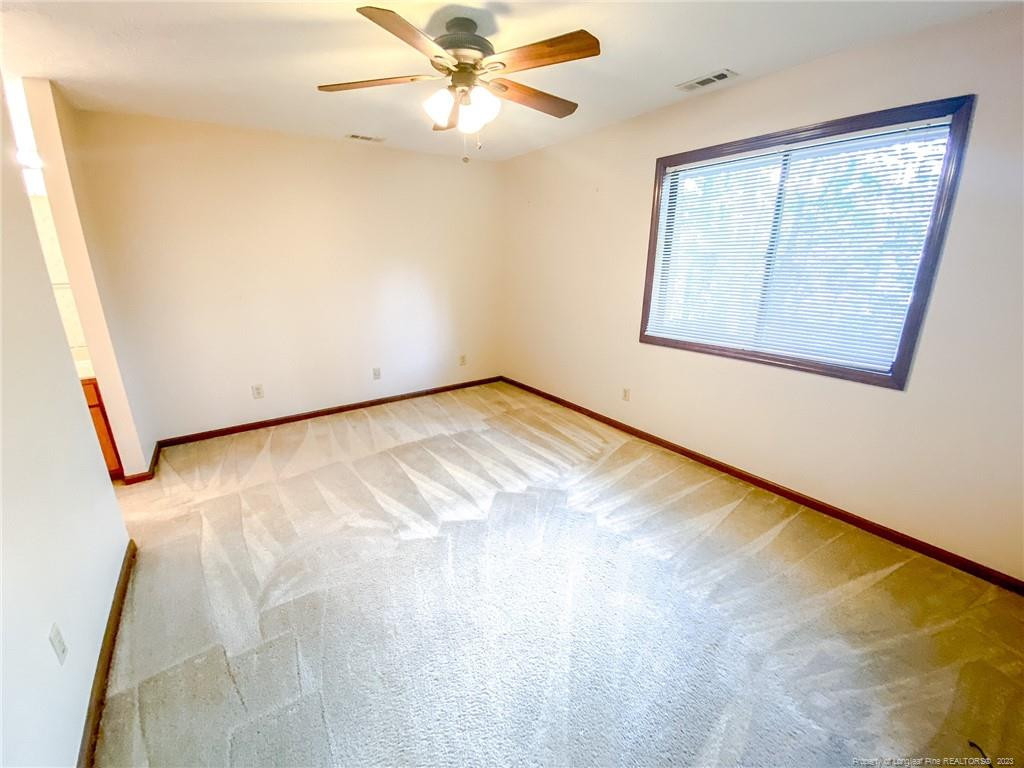 207 Charmant Road Lumberton, NC 28358 - Photo 13 of 24 a view of an empty room with a window