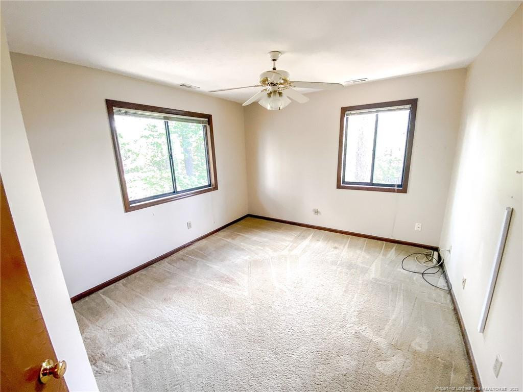 207 Charmant Road Lumberton, NC 28358 - Photo 18 of 24 a view of an empty room with a window