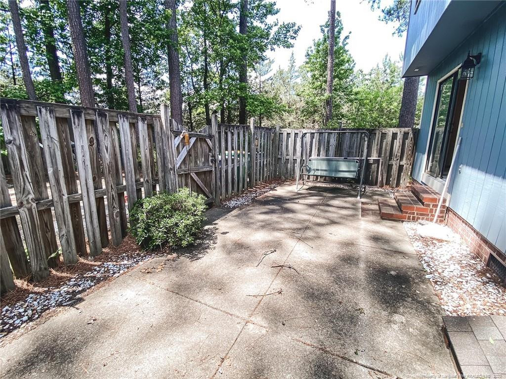 207 Charmant Road Lumberton, NC 28358 - Photo 20 of 24 a view of outdoor space with wooden fence