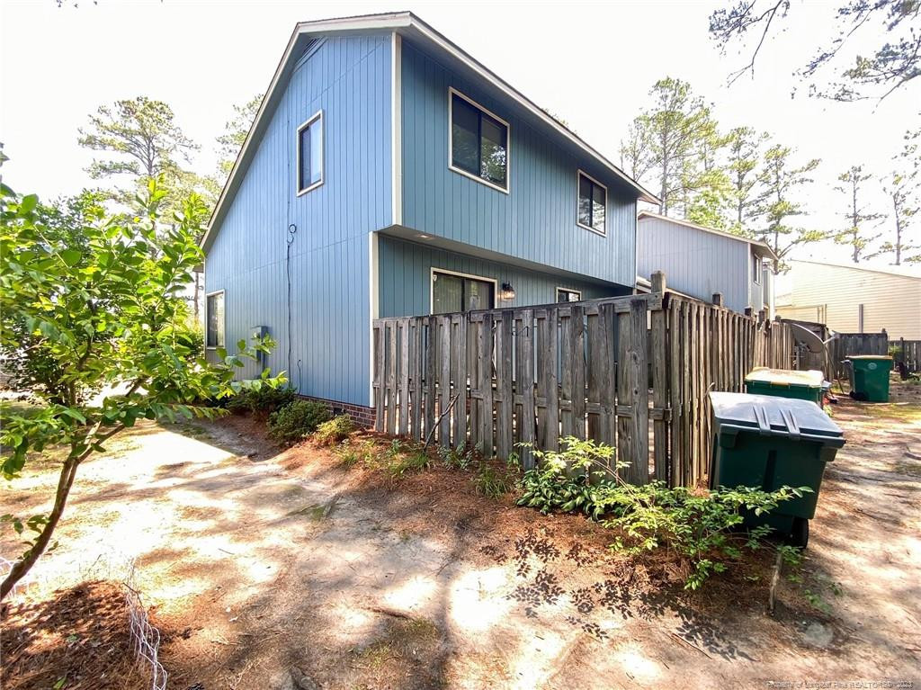 207 Charmant Road Lumberton, NC 28358 - Photo 23 of 24 a backyard of a house with lots of green space