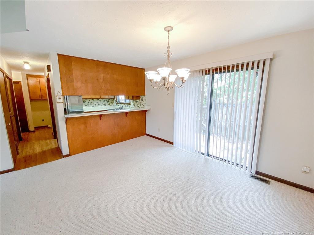 207 Charmant Road Lumberton, NC 28358 - Photo 6 of 24 a view of a room with a large window