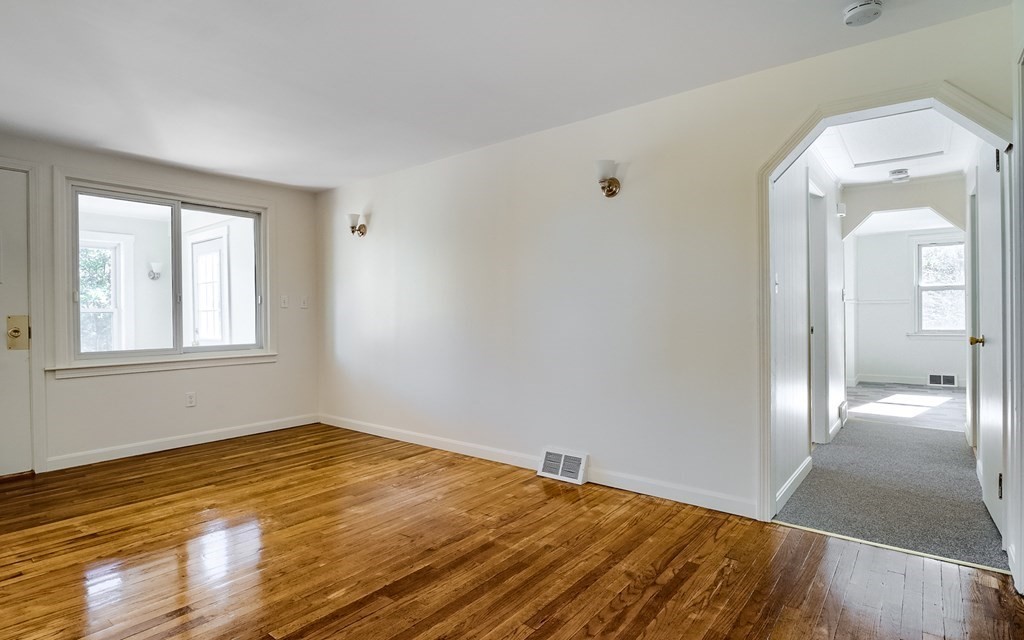 140 Leominster Road Sterling, MA 01564 - Photo 11 of 35 a view of a livingroom with wooden floor and a bathroom