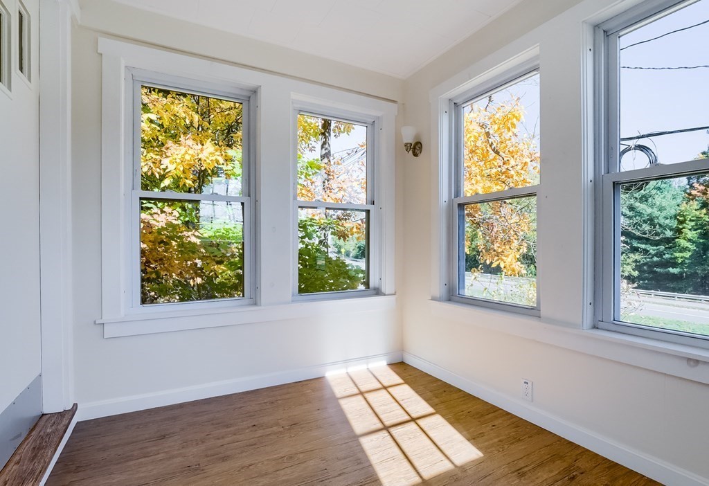 140 Leominster Road Sterling, MA 01564 - Photo 13 of 35 a view of an empty room with wooden floor and a window