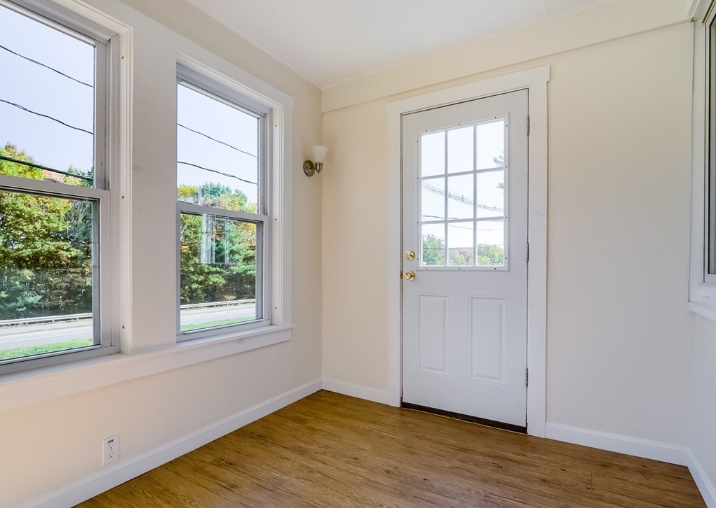 140 Leominster Road Sterling, MA 01564 - Photo 14 of 35 an empty room with wooden floor and windows