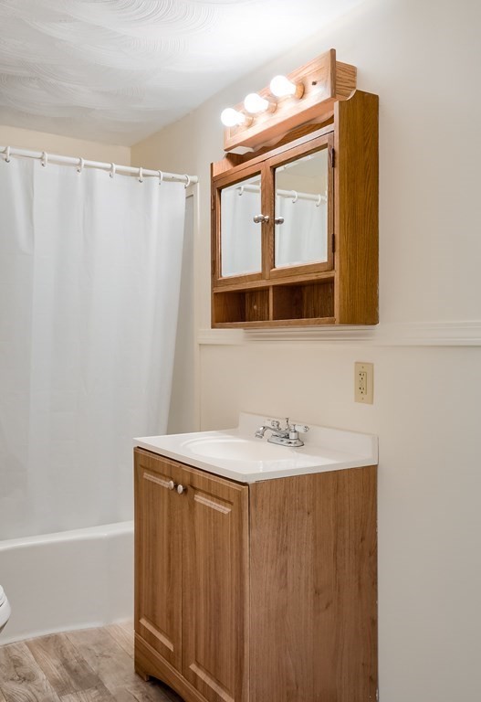 140 Leominster Road Sterling, MA 01564 - Photo 16 of 35 a bathroom with a sink a mirror and a bathtub