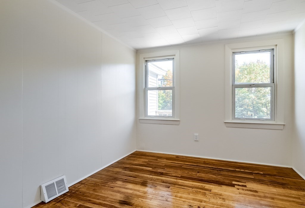 140 Leominster Road Sterling, MA 01564 - Photo 17 of 35 a view of a bedroom with wooden floor and window