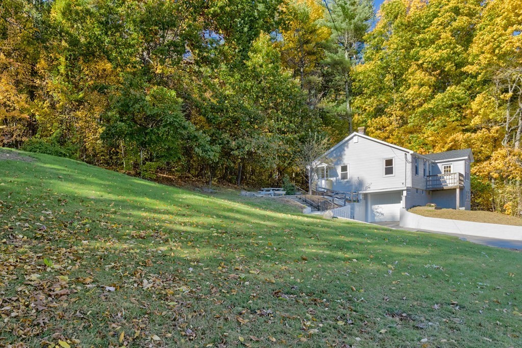 140 Leominster Road Sterling, MA 01564 - Photo 25 of 35 a view of a house with a backyard