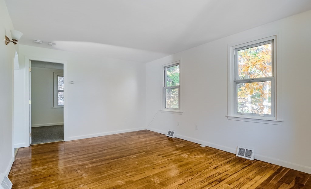 140 Leominster Road Sterling, MA 01564 - Photo 9 of 35 a view of empty room with wooden floor and fan